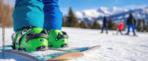 Ski boots and snowy mountain landscape for winter sports and outdoor recreation photo