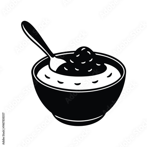 Bowl of hummus with serving spoon