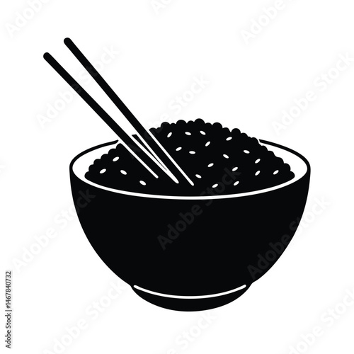 Bowl of rice with chopsticks placed beside