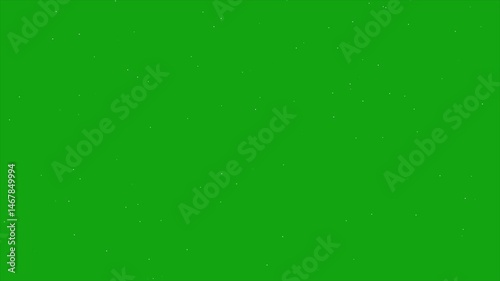 a green screen background with a few small dots