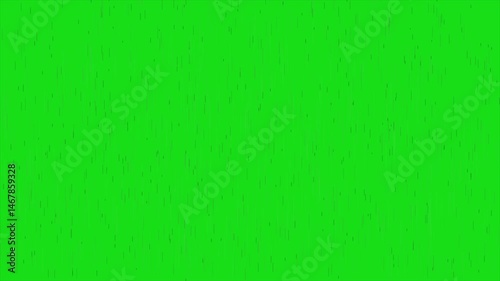 a green screen background with a few small dots