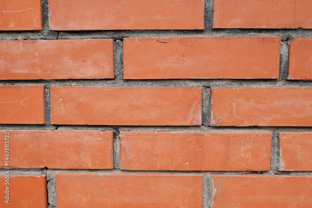 Clean red brick wall with straight lines and visible cement joints. Ideal for use as a construction background, architectural texture, or building material detail. Clean red brick wall with straight lines and visible cement joints. Ideal for use as a construction background, architectural texture, or building material detail.