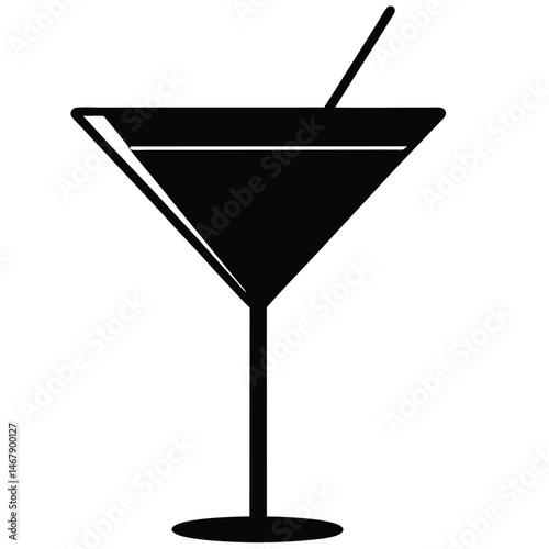 An elegant black martini glass with stirrer creates a stark minimalist icon