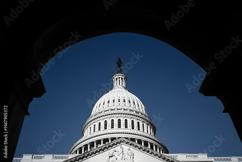 The United States Capitol dome against a clearing blue sky viewed from the east front of the U.S. Capitol building in Washington, DC.