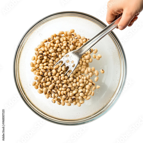 Preparation of organic black-eyed peas with a kitchen fork isolated on transparent background