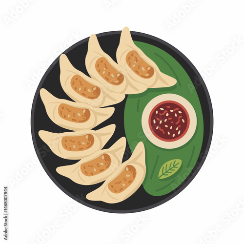 Guotie Pan-Fried Dumplings with Dipping Sauce on Serving Plate