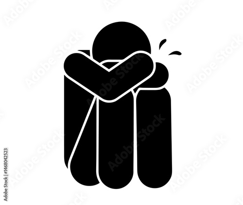 person sitting with head on arms and tear, sadness, crying, emotional distress, and mental health awareness.