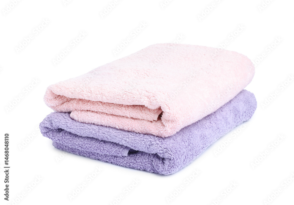 Two folded terry towels isolated on white Two folded terry towels isolated on white
