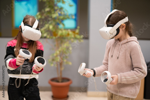 a child in virtual reality glasses plays a game
