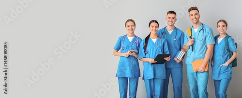 Fotografie Group of medical students on grey background with space for text