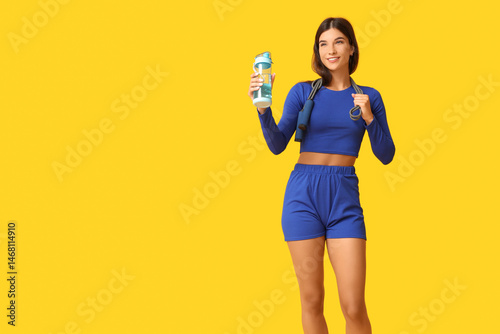 healthy lifestyle and fitness motivation, young woman in sportswear holding w...