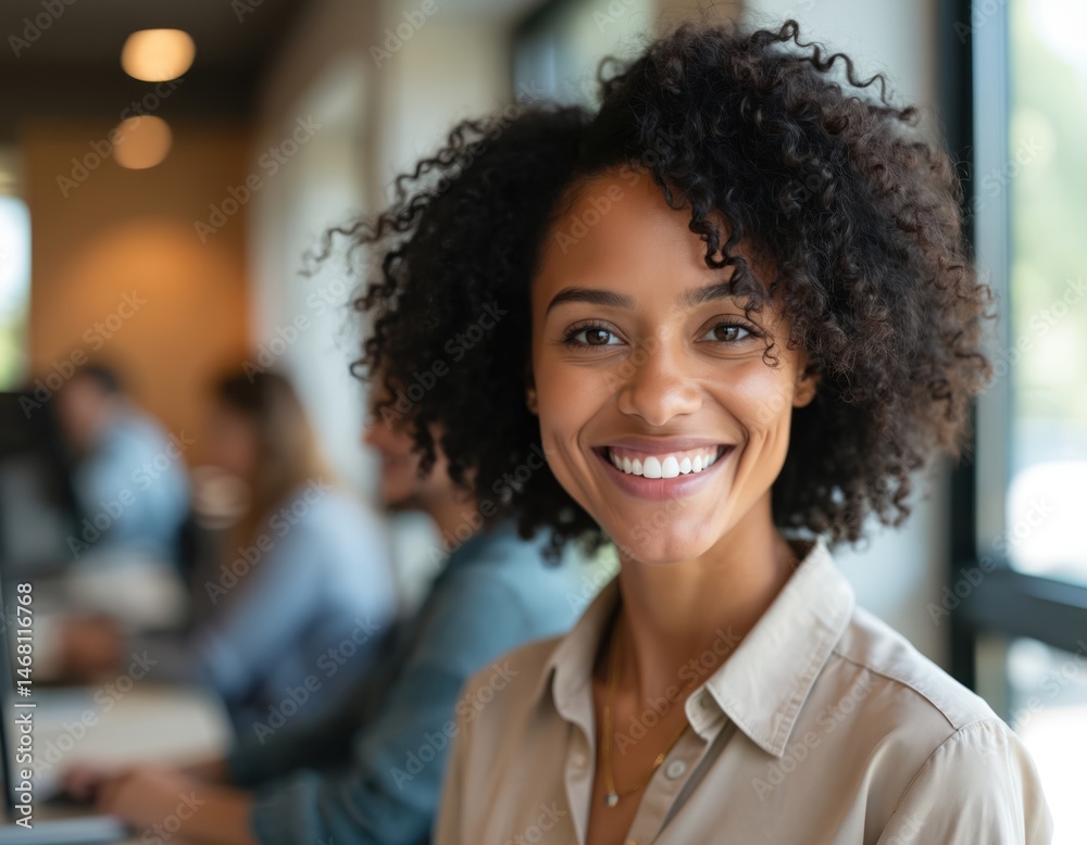 Smiling black woman with curly hair in modern office setting. Confident businesswoman with bright natural light. Happy, stylish, pro female smiling. Diversity in workplace, career, business, success. Smiling black woman with curly hair in modern office setting. Confident businesswoman with bright natural light. Happy, stylish, pro female smiling. Diversity in workplace, career, business, success.