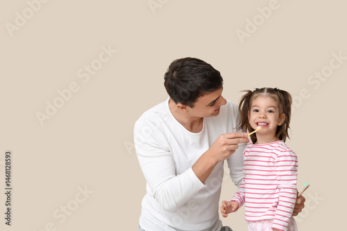 Happy father and his cute l...