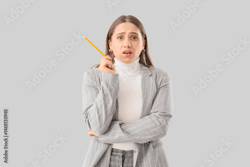 Puzzled businesswoman with ...