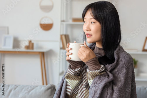 Young Asian woman with grey...