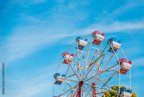 Ferris Wheel Ride with Blue Sky and Copy Space