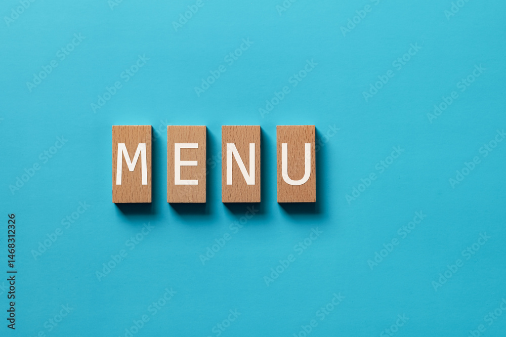 Obraz premium There is wood block with the word MENU. It is as an eye-catching image.