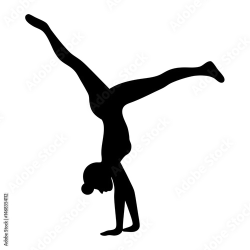 A silhouette of a woman performing a handstand with split legs extended