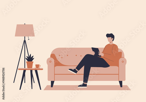 Man Enjoying Leisure Time on Sofa with Tablet