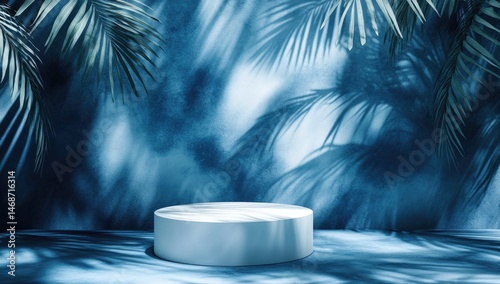 Serene blue backdrop with cylindrical display, tropical palm shadows