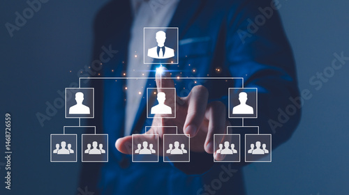 Obraz na płótnie Businessman point a glowing digital organizational chart, leadership and team structure. Manager team management of company, networking in business hierarchy job concept, president job change control w salonie
