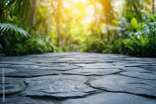 Stone path leads into lush green foliage with bright sunlight above. This image can represent travel, gardens, or finding your own path.