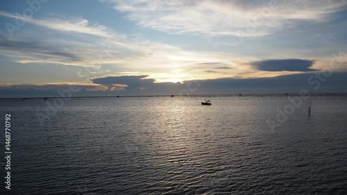 Timelapse of beautiful clouds over the sea, evening sunset light.