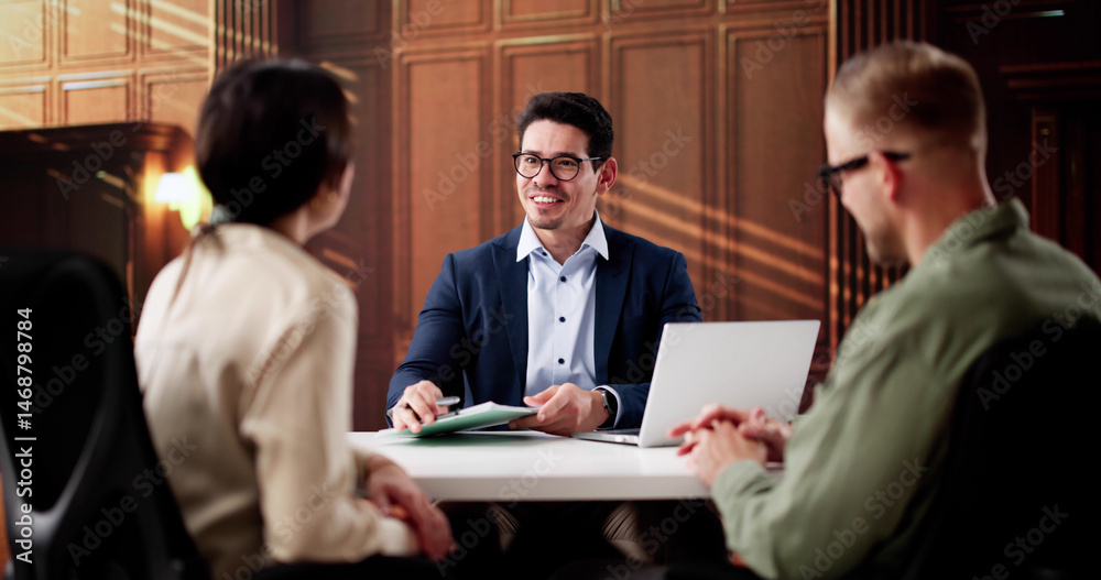 Fototapeta premium Family Lawyer Consults With Divorcing Couple In Court Proceedings