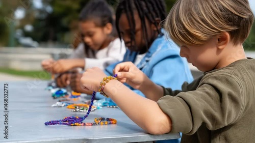 Kids Creating Colorful Friendship Bracelets for Community Benefit