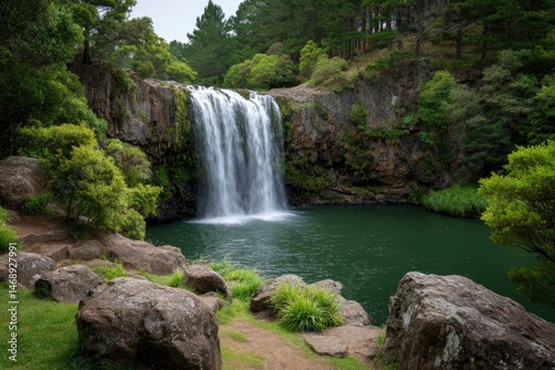 Serene Waterfall Cascading into Emerald Pool: A Tranquil Landscape