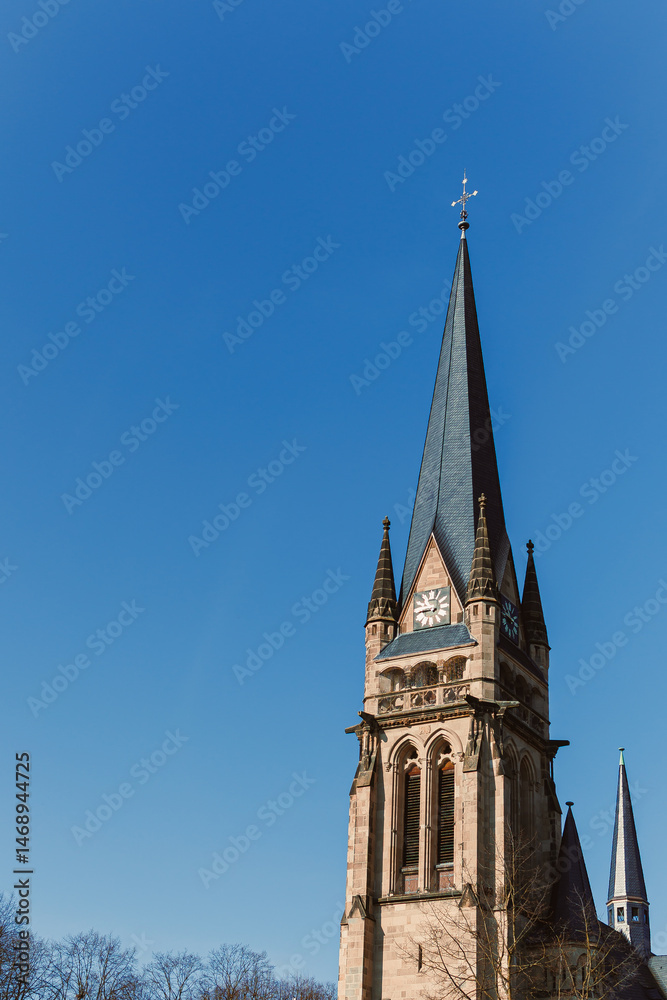 Ancient city buildings. Ancient brick church. Catholic cathedral made of stone.