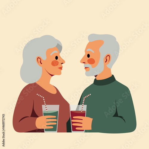 Elderly couple sharing drinks and smiling against a simple background  
