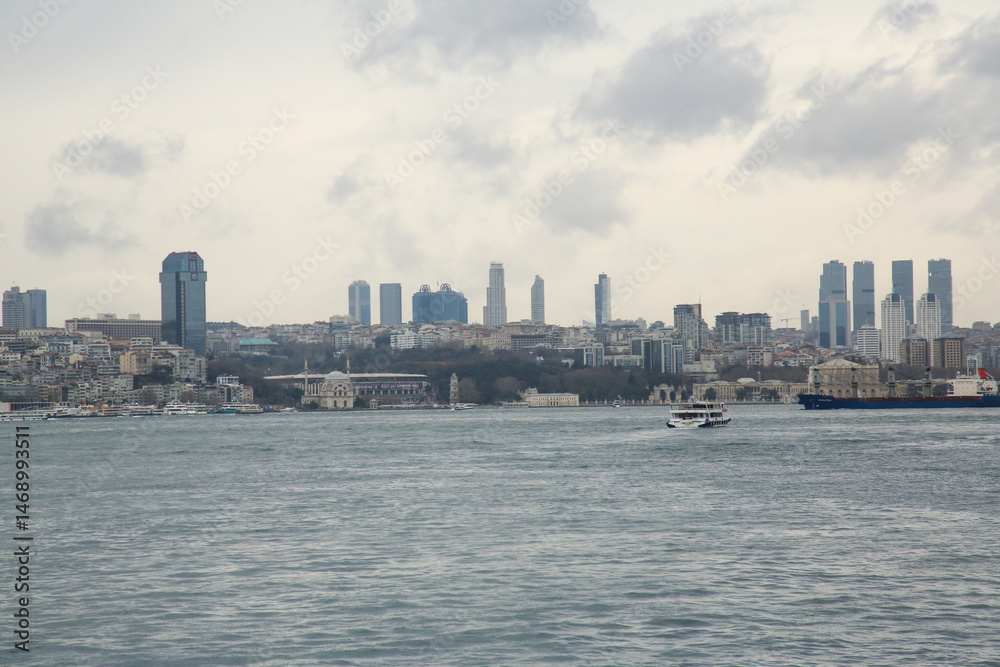 Fototapeta premium Spring, Istanbul view from the sea. high-rise buildings, modern glass city and historic buildings. cityscape of Istanbul, Turkey, a popular tourist destination. Panoramic view of the city