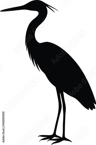  Black silhouette of a heron standing gracefully.