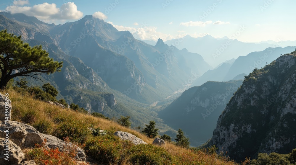 Obraz premium Panoramic midday scene of Montsec Range with sunlit peaks and clear skies.