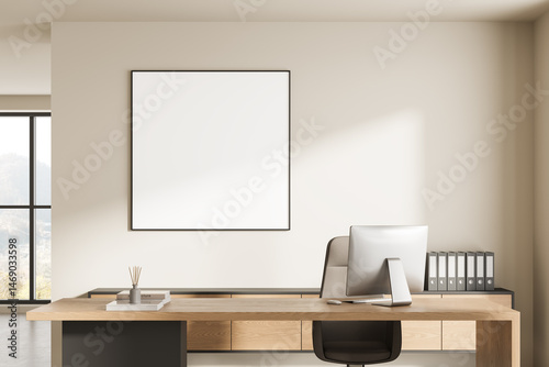 Modern minimalist office interior with wooden desk, computer, binders, and blank frame on wall in bright workspace with large window. 3D Rendering