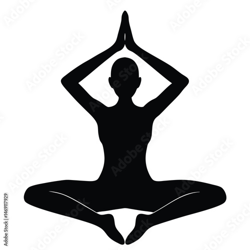 Silhouette of a woman practicing yoga in a butterfly pose with hands joined above