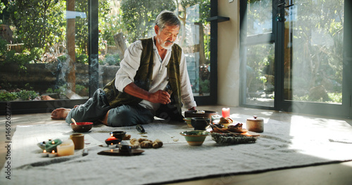 Fotografia Floor, alternative medicine and Asian man for holistic treatment, spiritual meditation and healing