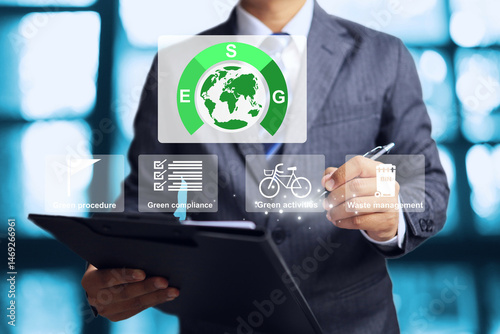 Vászonkép Green business concept with a businessman and ESG procedure data summary of co2