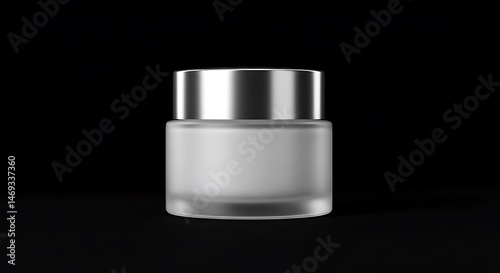 Elegant Frosted Glass Cream Jar with Silver Lid on Black Background