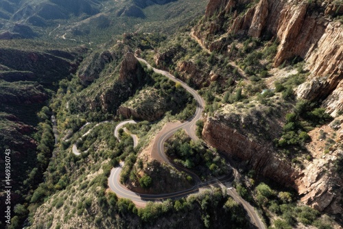 Obraz na płótnie Aerial View of Winding Switchback Road Navigating Through a Mountainous Landscape in Clear Weather Generative AI w salonie