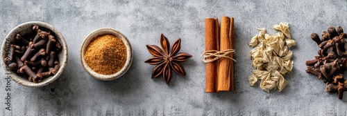 Obraz na płótnie Autumn Spices Arranged in an Elegant Flatlay Showcasing Cloves, Cinnamon Sticks, and Star Anise on a Textured Surface Generative AI w salonie