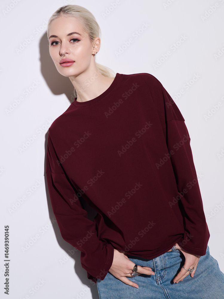 Fototapeta premium Girl model in stylish clothes posing in studio, fashion photo.