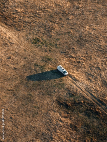 Van Parked in an Open Field Under the Bright Sun During Midday With a Clear Blue Sky Above Generative AI