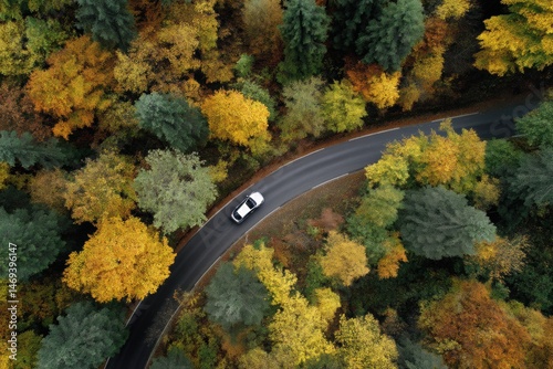 Obraz na płótnie Car Drives Along Winding Road Through Colorful Autumn Forest With Vibrant Foliage Generative AI w salonie