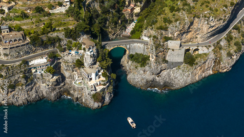 Aerial view of the Furore fjord bridge, a small hidden treasure of the Amalfi Coast, in the province of Salerno, Campania, Italy. The road that crosses it is the Amalfi Drive.