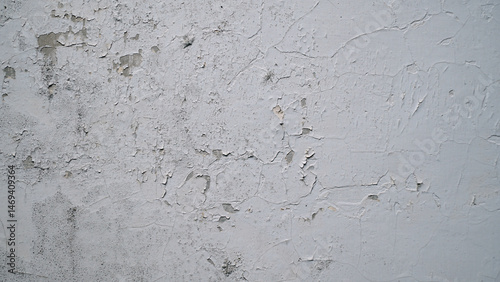 White wall with cracked and peeling surface