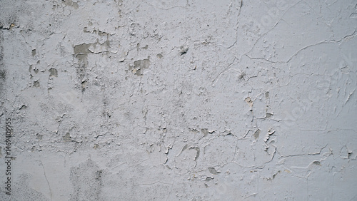 White wall with cracked and peeling surface