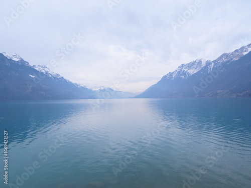 A view of the Brienz lake in Winter with the swiss Alps in the background. Brienz, Switzerland - February 10, 2025. 