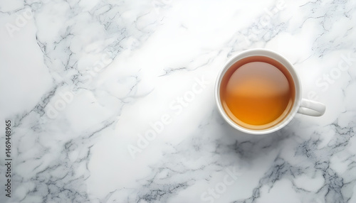 Refreshing green tea in a cup on a marble table on a white background. Space for text